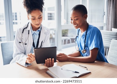 Tablet, black woman or doctors with medical research reading news or tests results in hospital together. Teamwork, digital tech or African nurses planning or speaking of healthcare report on website - Powered by Shutterstock