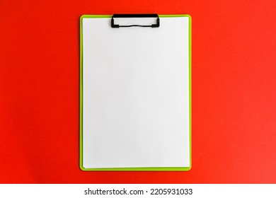 Tablet With A Blank Sheet On A Red Background