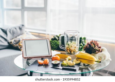 Tablet With Calorie Counting App On Kitchen Table Near Fresh Vegetables. 