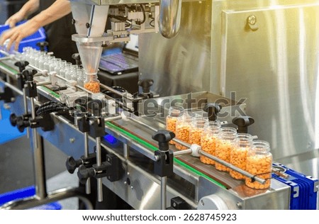 Tablet Capsule counting machine conveyor in production line of pharmaceutical industry.
