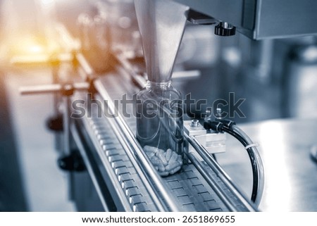 Tablet, Capsule counting machine conveyor in production line of pharmaceutical industry.