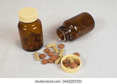 Tablet and capsule forms of supplements are displayed next to two pill bottles.