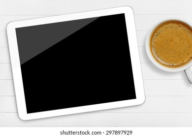 Tablet and coffee cup