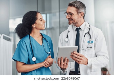 Tablet, collaboration and team of doctors in a hospital analyzing results or diagnosis of patient. Teamwork, medical and healthcare workers in discussion and research on mobile device in a clinic. - Powered by Shutterstock