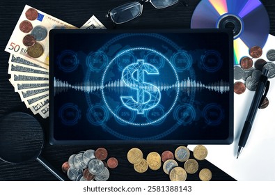 Tablet computer with glowing dollar symbol, stock data and percentage charts on table. Investment and cyberspace concept.