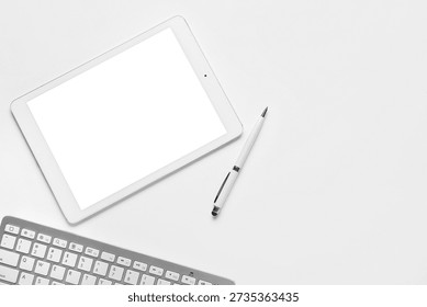 Tablet computer, keyboard and pen on white background, closeup