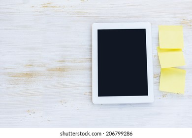 tablet computer with stickers on the table