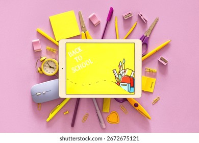 Tablet computer with text BACK TO SCHOOL and stationery on lilac background