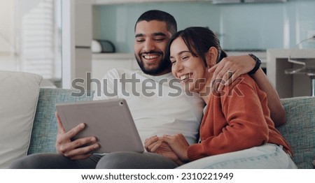 Tablet, couple and laughing on couch in home for social media, funny news and online meme. Happy man, woman and relax with digital technology, subscription and streaming comedy on network connection