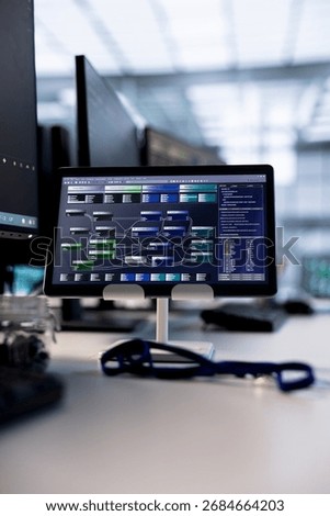 Tablet in data center providing computing resources for artificial intelligence processing massive datasets for training. Close up of code lines on device in server room used for machine learning