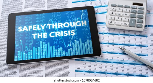 A tablet with financial documents - Safely through the crisis
