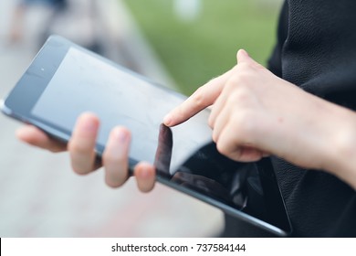 tablet in hand close-up                               