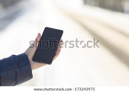 tablet in hand in winter