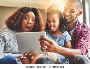 Tablet, happy family and funny selfie in home together for social media, bonding or laughing. Kid, mom and father on digital technology for picture with shocked face, wow or tongue out in living room - Powered by Shutterstock