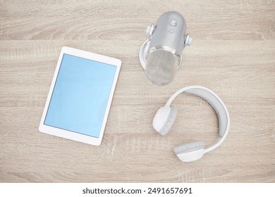 Tablet, headphones and microphone for podcast recording, online and mockup on technology, Digital, live streaming or equipment for broadcasting on internet, interview and audio for app or radio media - Powered by Shutterstock