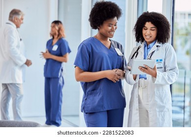 Tablet, healthcare or collaboration with a doctor and nurse talking in the hospital while doing research. Medical, teamwork and trust with professional colleagues in medicine working in a clinic - Powered by Shutterstock