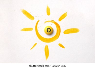 Comprimido con la inscripción Vitamina D en el centro del sol