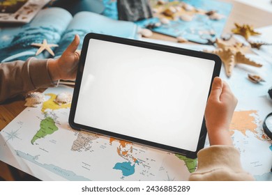 Tablet with isolated screen in child's hands, studying geography concept. - Powered by Shutterstock