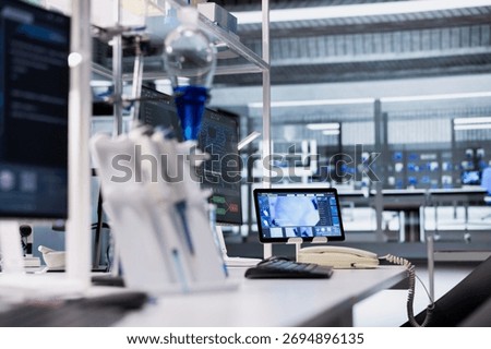 Tablet in lab with app interface showing genetic markers associated with disease risk. Digital device in laboratory used to study DNA strand mapping with genomics analysis program