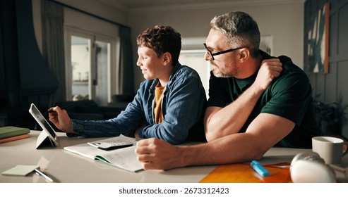 Tablet, math and help with father and son in kitchen for learning app, education or teaching. Growth, online school schedule and support with man and kid in family home for reading and homework