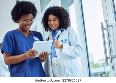 Tablet, medicine or collaboration with a doctor and nurse talking in the hospital while doing research. healthcare, teamwork and trust with professional medical colleagues working in a clinic - Powered by Shutterstock