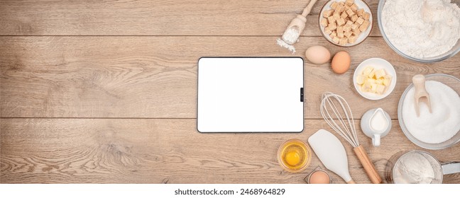 Tablet mock up template with Baking pastry or cake ingredients, brown sugar, butter, flour, eggs and milk with utensil. - Powered by Shutterstock