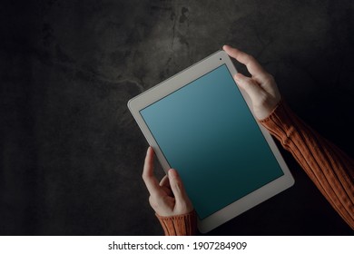 Tablet Mockup Image. Display Screen Is Clipping Path. Woman Using Digital Tablet On Working Desk