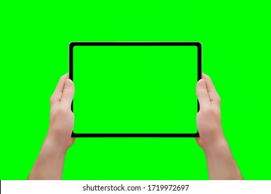 Tablet mockup in man hands isolated in chroma key green. Front position. Close-up - Powered by Shutterstock