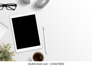 Tablet Mockup On White Desk With Free Space On Right Side For Text. Flat Lay Composition.