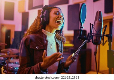 Tablet, music and woman singing in a studio for radio, song production and rehearsal. Creative, voice and a singer making a record, track or recording a musical sound as a professional artist - Powered by Shutterstock