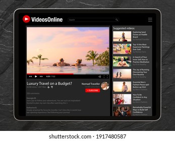 Tablet on dark background with online video app on screen
