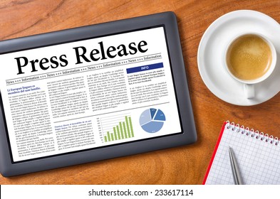 Tablet on a desk - Press Release - Shutterstock ID 233617114