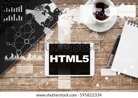 Tablet on desktop with html5 text.
