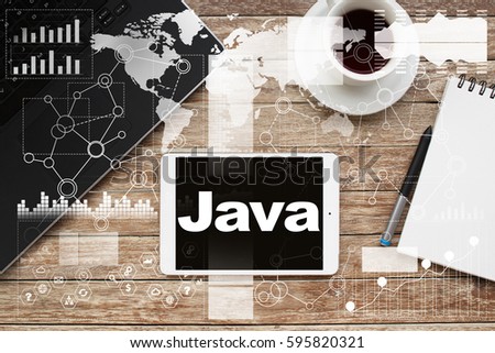 Tablet on desktop with java text.