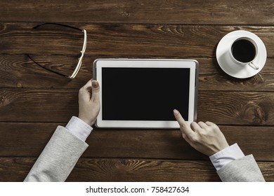 Tablet pc with blank screen in hands