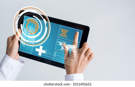 Tablet pc device with medicine interface screen in hands of doctor