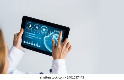 Tablet pc device with medicine interface screen in hands of doctor