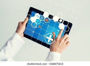 Tablet pc device with medicine interface screen in hands of doctor