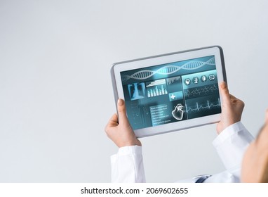 Tablet pc device with medicine interface screen in hands of doctor - Shutterstock ID 2069602655
