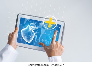 Tablet pc device with medicine interface screen in hands of doctor