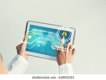 Tablet pc device with medicine interface screen in hands of doctor