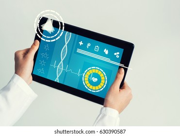 Tablet pc device with medicine interface screen in hands of doctor