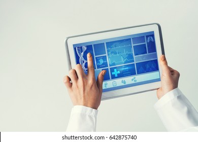 Tablet pc device with medicine interface screen in hands of doctor