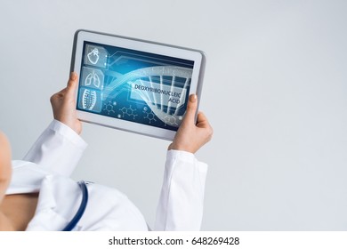 Tablet pc device with medicine interface screen in hands of doctor