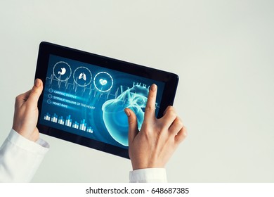 Tablet pc device with medicine interface screen in hands of doctor