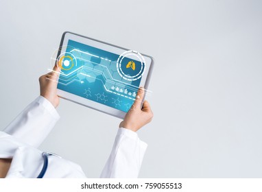 Tablet pc device with medicine interface screen in hands of doctor