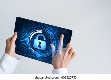 Tablet Pc Device With Security Padlock On Screen In Hands Of Doctor