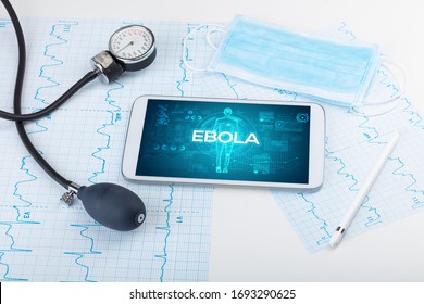 Tablet pc and doctor tools with EBOLA inscription, coronavirus concept