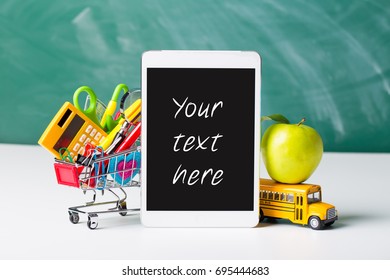 Tablet pc, notebook stack and pencils. Schoolchild and student studies accessories. Back to school concept.