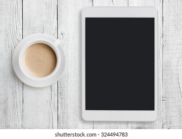 Tablet Pc On White Table Desk With Coffee Cup